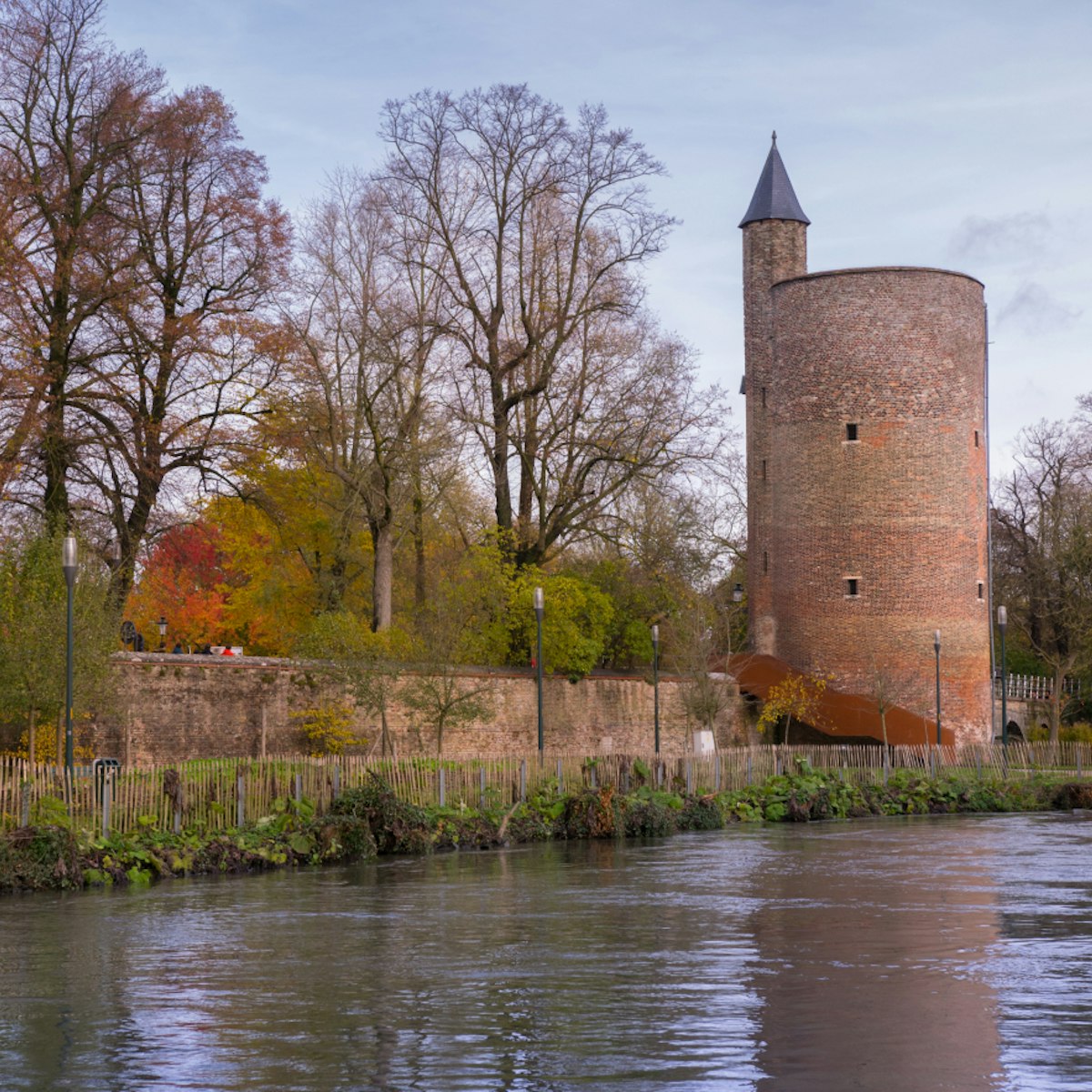 Tower in Minnewater park in Bruges, Belgium; Shutterstock ID 525022591; Your name (First / Last): Daniel Fahey; GL account no.: 65050; Netsuite department name: Online Editorial; Full Product or Project name including edition: POI image