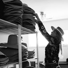 Staff helping customers with hats at JW Bennett in Jackson Hole, Wyoming