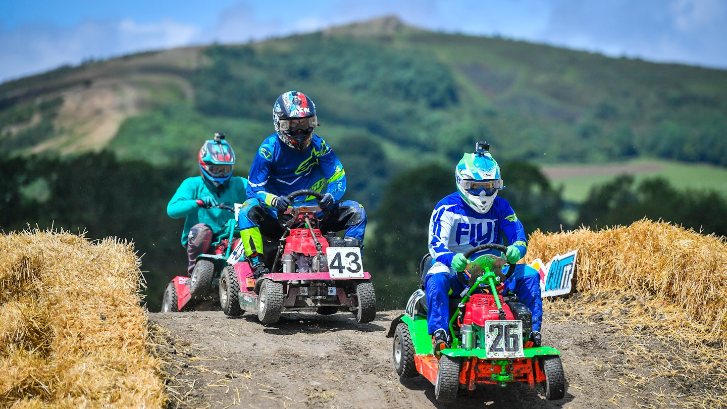 Lawn mower racing
Competitors battle it out during the Red Bull Cut It, lawn mower racing event, where participants reach speeds of up to 50mph on modified ride-on lawnmowers as they navigate their way around four separate courses at Chestnut House, in Lower Weare, Axbridge. (Photo by Ben Birchall/PA Images via Getty Images)