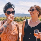 Best friends on vacation at oregon winery
1487569796
Two women drinking wine in the sunshine in a vineyard