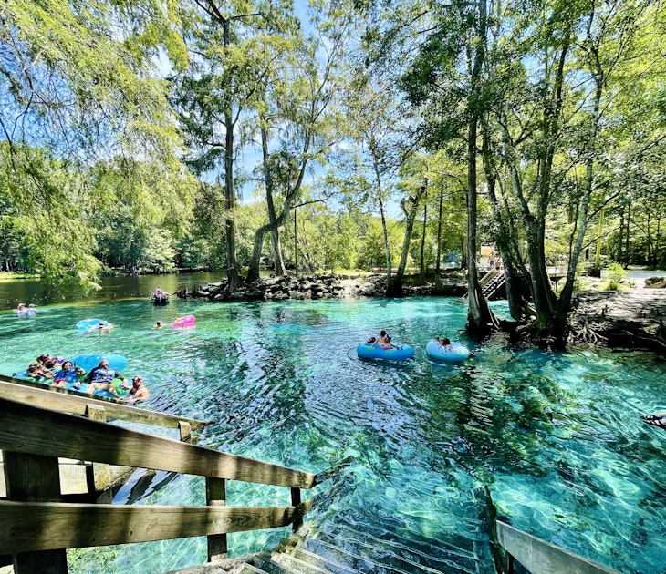 Tubers and swimmers float in the shallow clear aqua spring waters near Devil's Eye in the Devil's Run spring, Ginnie Springs, Florida
1498981596