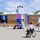 A wheelchair user, a member of the Paris Olympics staff, is walking past the official store located in front of the Grand Palais, in Paris, France on july 28, 2024. (Photo by Vincent Koebel/NurPhoto via Getty Images)
2163625334
inclusivity, city landmark, adaptive sports, cultural event, paris olympics, event staff, retail location, sports merchandise, public space, international event, athlete support, olympic games, official store, olympic staff, adaptive equipment, paris, nurphoto, urban environment, event planning, mobility, staff member, event photography, wheelchair user, vincent koebel, 2024 olympics
A wheelchair user, a member of the Paris Olympics staff, is walking past the official store located in front of the Grand Palais, in Paris, France on july 28, 2024.