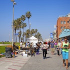 Venice Beach, Los Angeles, USA- February 23, 2014: Tourists and locals along the famous Venice Beach promenade.