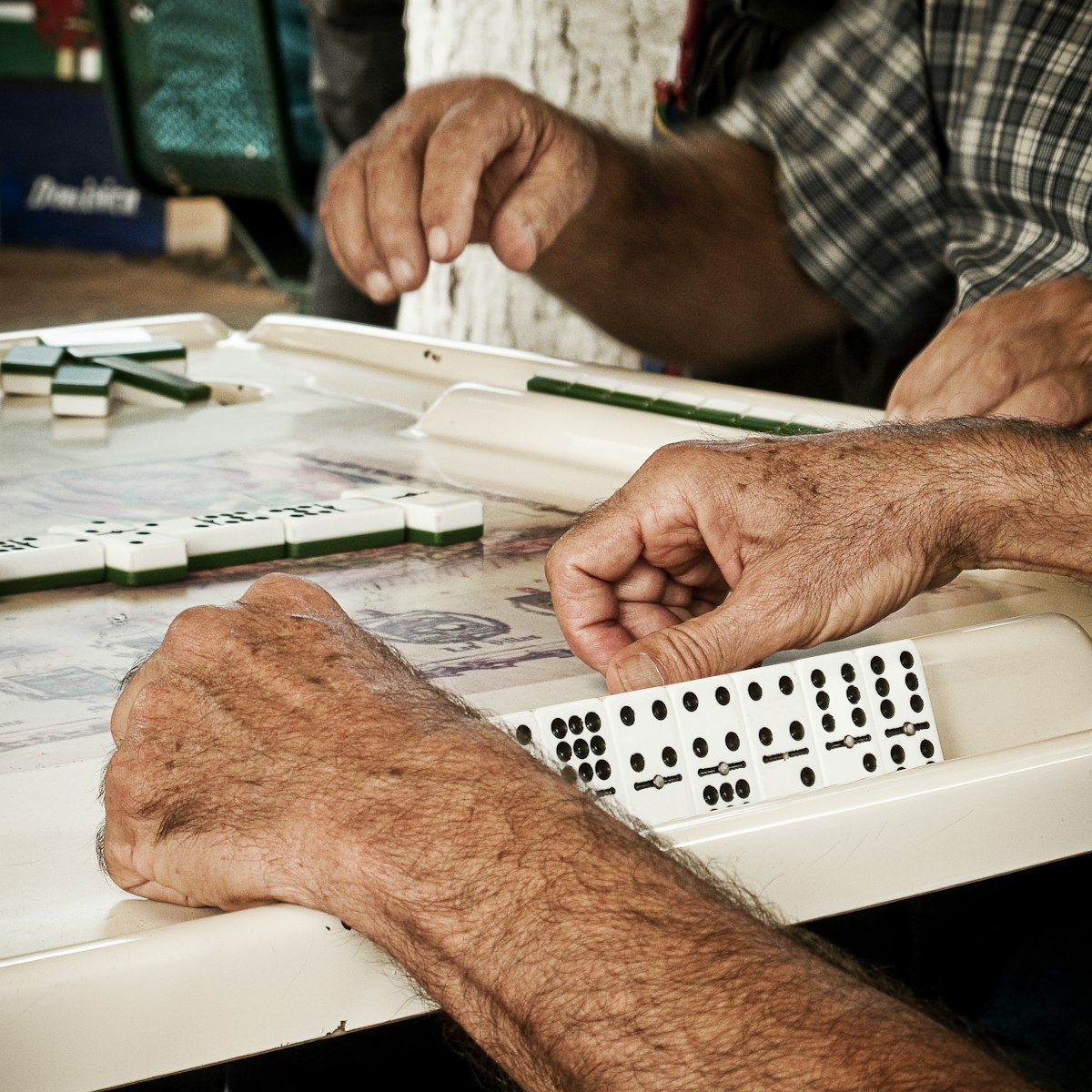 Domino players in Maximo Gomez Park, Little Havana, Miami, Florida, USA