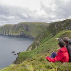 Father and son admires beauty landscape. Location Horn Head in Ireland co. Donegal
612641674
Horizon Over Water, Real People, One Parent, Non-Urban Scene, Boys, Men, Two People, Looking Away, Seascape, Teenager, Child, Explaining, Looking, Resting, Healthy Lifestyle, Scenics, Discussion, Relaxation, Love, Exploration, Tranquil Scene, High Up, Vacations, Nature, Lifestyles, Childhood, Outdoors, Recreational Pursuit, Tourist, Son, Offspring, Father, Parent, Family with One Child, Family, People, Republic of Ireland, Summer, Springtime, Rock - Object, Cliff, Mountain Range, Mountain, Hill, Sea, Irish Landscape, Single Father, Active Family, Simple Living
Ireland-County-Donegal-Horn-Head-arkanex-GettyImages-612641674-RFC