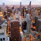 High-angle view of downtown Chicago during twilight.
655973696
Hotel, Silhouette, Aerial View, Business Finance and Industry, Skyscraper, Office, Building Exterior, City, Illinois, Twilight, Observatory, Street, Sky, Business, Traffic, Modern, Urban Skyline, Built Structure, Skyline Arch, Willis Tower, Cityscape, Architecture, Dusk, Michigan, House, Panoramic, Sunset, Tower, Antenna - Aerial, Looking At View, Tall - High, Chicago - Illinois, Eastern USA, Lake Michigan, Tourist, City Street, Rock - Object, USA, Manhattan Financial District, Famous Place, Photography, Outdoors, High Angle View, Downtown District, Lake, Travel Destinations, Horizontal, High Up, Office Building Exterior, North America, Night