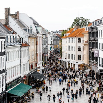 High-angle view of a busy shopping street in Copenhagen.
Rooftop, Photography, Denmark, Road, Population Explosion, Scandinavian Culture, Overcast, City, Window, Cafe, Tourist, Consumerism, Restaurant, Copenhagen, Facade, City Life, Danish Culture, Aerial View, Urban Skyline, Day, Diminishing Perspective, Amagertorv, Crowd, Retail, City Street, Capital Cities, Town Square, Sky, Street, Famous Place, International Landmark, Large Group Of People, Tourism, Retail Place, Shopping, Travel, Cityscape, Architecture, Old, Oresund Region, Building Exterior, People, Color Image, Sidewalk Cafe, Outdoors, High Angle View, Travel Destinations, Horizontal, Pedestrian Zone