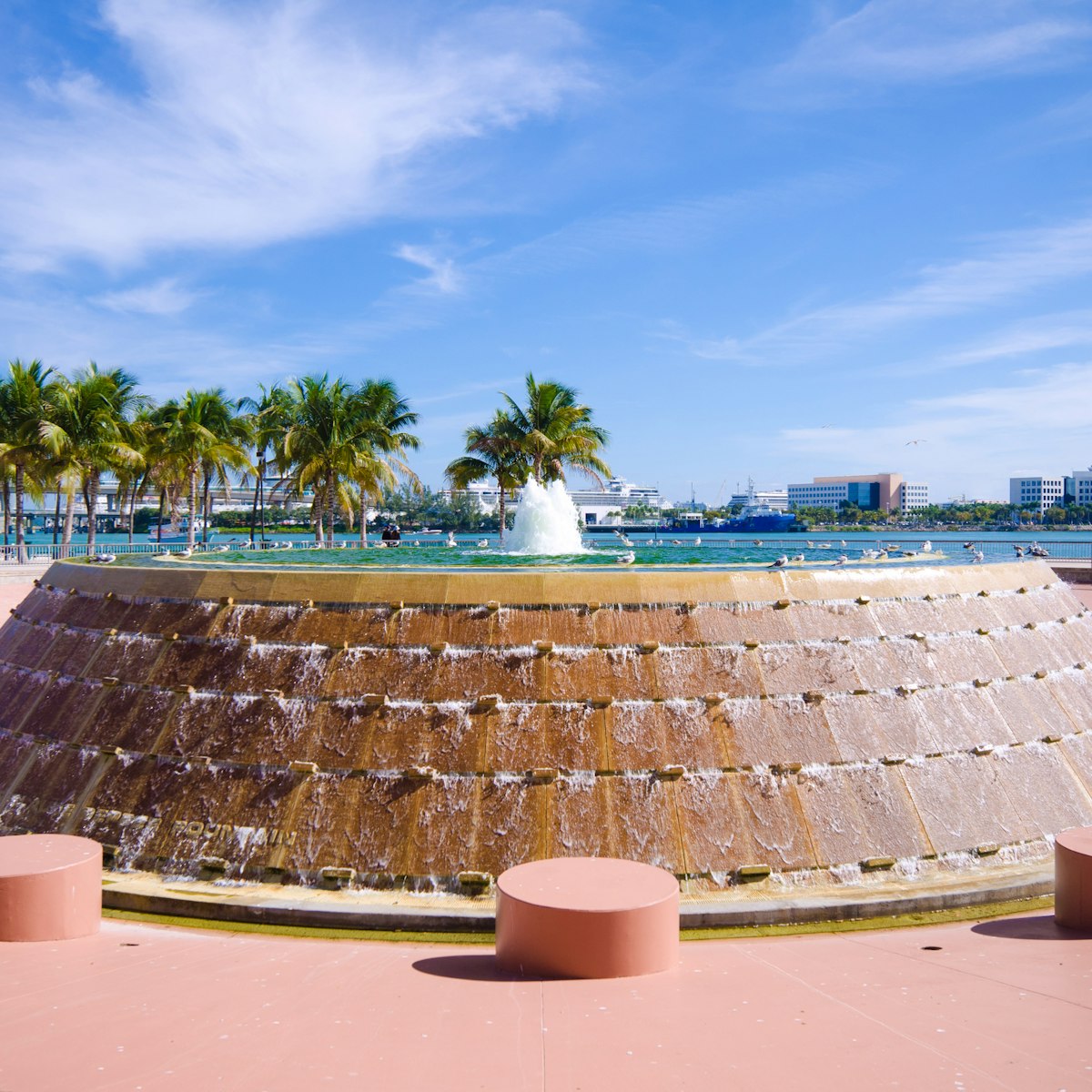 Fountain at Bayfront Park in the downtown area of Miami, FL with Biscayne Bay in the distance.