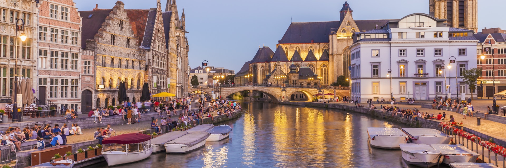 Korenlei and Graslei on the River Leie in Ghent's old town at dusk.