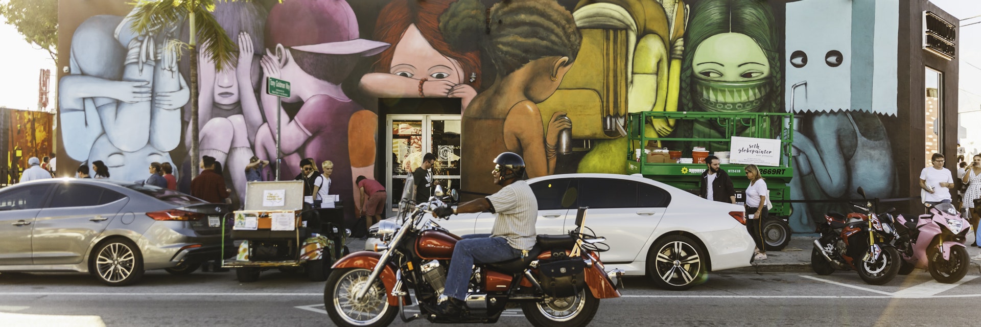 Traffic passes colourful street art in Miami's Wynwood District.