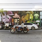 Traffic passes colourful street art in Miami's Wynwood District.