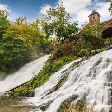 Long exposure of stunning and popular waterfalls in the Belgian Ardennes, Waterfalls of Coo, province of Liege, Wallonia, Belgium. Beautiful nature and sunny day.