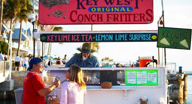 Tourists at conch fritter stand on Mallory Square