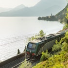 Train hugging the shore of Lake Como
Contributor, LP Owned, Issue 82, London to Venice by Train, Lonely Planet Traveller Magazine, Landscape, Nature, Outdoors, Railway, Scenery, Train, Vehicle