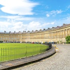 Bath ,England - AUG 30 2019 : The famous Royal Crescent at Bath Somerset England, United Kingdom.; Shutterstock ID 1601122237; full: 65050; gl: Lonely Planet Online Editorial; netsuite: Top 16 places in England; your: Brian Healy
1601122237
ancient, architecture, bath, blue, british, building, city, cityscape, crescent, culture, england, english, europe, european, famous, garden, georgian, georgian architecture, heritage, landmark, old, palladian style, royal, royal crescent, royal crescent bath, sky, somerset, style, summer, terrace, terraced houses, the royal crescent, tourist, touristic, town, townhouses, travel, uk, urban, view