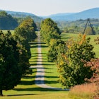 New Windsor, NY, USA-Sept 2019; Panoramic view over the dirt road, grasslands and forest and one of the steel sculptures of Storm King Art Center, License Type: media, Download Time: 2024-09-01T16:59:08.000Z, User: pinkjozie64, Editorial: true, purchase_order: 56530, job: Global Publishing WIP, client: Experience New York 2, other: Jo-anne Riddell