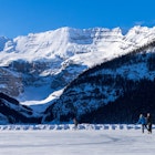 Tourists skating on Lake Louise winter ice skating rink. Banff National Park, Canadian Rockies. Alberta, Canada., License Type: media, Download Time: 2024-08-23T16:48:26.000Z, User: joe_lp, Editorial: false, purchase_order: 56530, job: Global Publishing-Wip, client: Your Ultimate Travel Adventure List, other: Joe Fullman