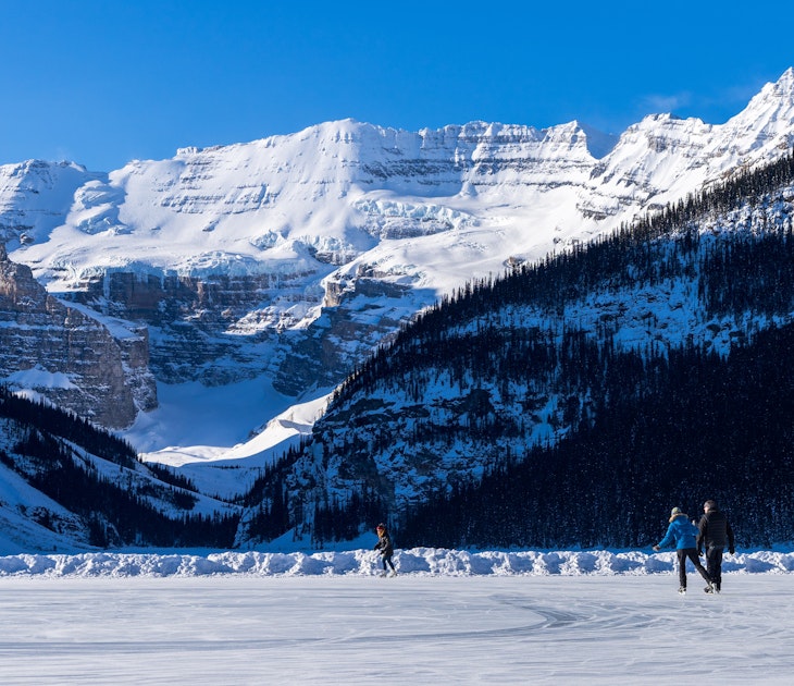 Tourists skating on Lake Louise winter ice skating rink. Banff National Park, Canadian Rockies. Alberta, Canada., License Type: media, Download Time: 2024-08-23T16:48:26.000Z, User: joe_lp, Editorial: false, purchase_order: 56530, job: Global Publishing-Wip, client: Your Ultimate Travel Adventure List, other: Joe Fullman