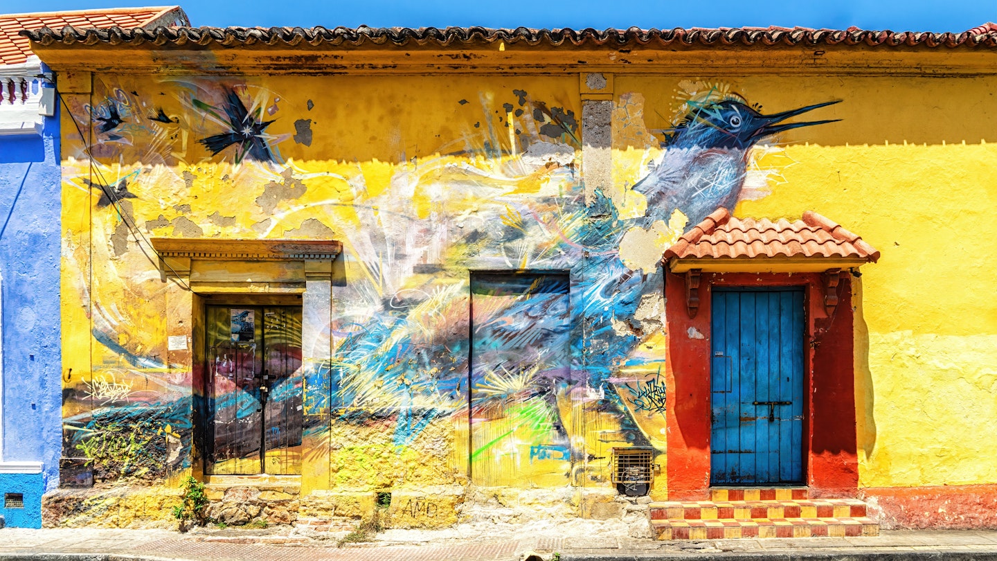 Cartagena, Colombia - 22 March 2023: Graffiti mural of a bird on a house on Holy Trinity square (Plaza Trinidad) in the Getsemani neighborhood of Cartagena, Colombia., License Type: media, Download Time: 2024-11-18T14:51:44.000Z, User: tasminwaby56, Editorial: true, purchase_order: 65050 - Digital Destinations and Articles, job: Online Editorial, client: Cartagena Best TTD, other: Tasmin Waby