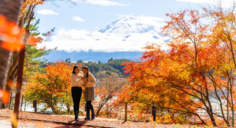 Happy Asian woman travel Japan on holiday vacation. Attractive girl friends using mobile phone taking selfie together while travel Mt.Fuji and looking beautiful red maple tree leaf falling in autumn; Shutterstock ID 2337439793; purchase_order:65050 - Digital Destinations and Articles; job:Online editorial; client:Japan cell connection: Saily ; other:Claire Naylor
2337439793