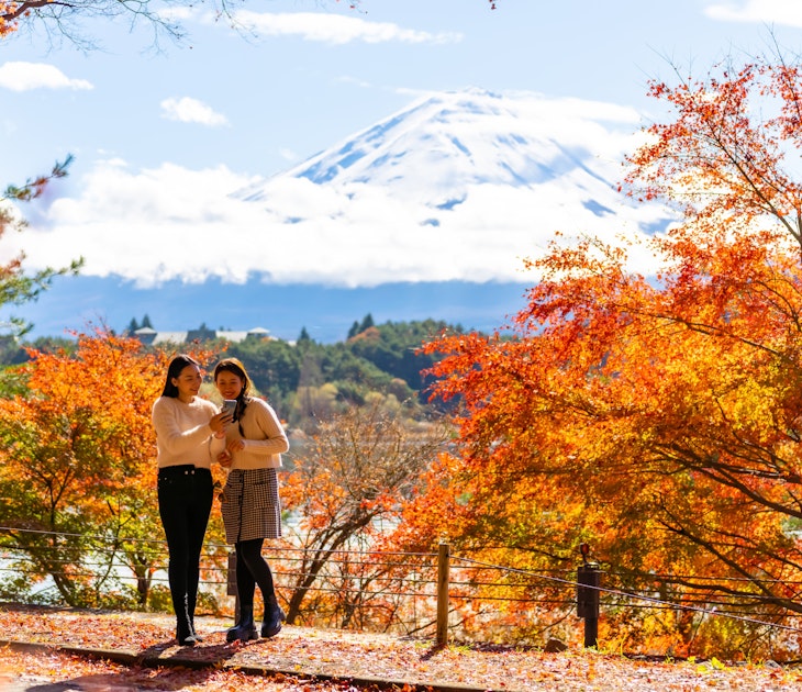 Happy Asian woman travel Japan on holiday vacation. Attractive girl friends using mobile phone taking selfie together while travel Mt.Fuji and looking beautiful red maple tree leaf falling in autumn; Shutterstock ID 2337439793; purchase_order:65050 - Digital Destinations and Articles; job:Online editorial; client:Japan cell connection: Saily ; other:Claire Naylor
2337439793