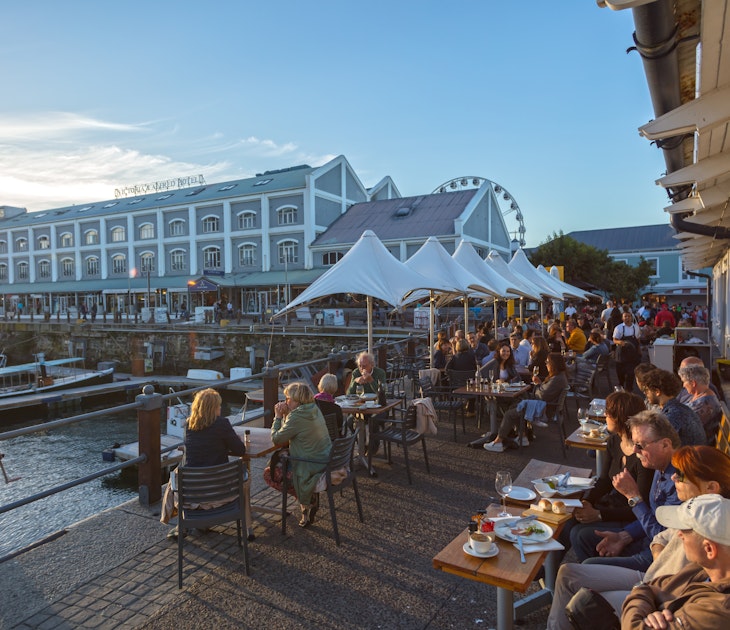 People Enjoying Beautiful Sunset in Restaurant.   Waterfront -Cape Town ,South Africa 11-11-2017, License Type: media, Download Time: 2024-08-30T14:45:46.000Z, User: bfreeman_lonelyplanet, Editorial: true, purchase_order: 65050, job: Online Editorial, client: Things to know South Africa, other: Bailey Freeman