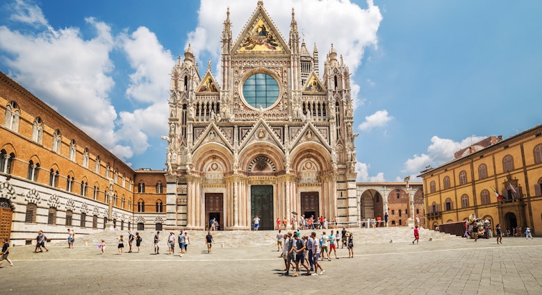 July 9, 2015: Exterior of Duomo di Siena, a medieval church in Siena.
695817532
ancient, architecture, attraction, basilica, blue, building, cathedral, church, city, duomo, europe, famous, heritage, historic, history, italy, landmark, medieval, old, religion, renaissance, siena, square, tower, town, tuscany