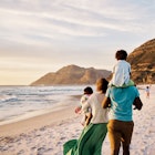 Rear of a family walking on the beach with copy space. African parents with little kids bonding and strolling by ocean. Little children enjoying the outdoors during their summer holidays or vacation
1408174631