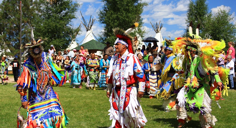 CHEYENNE, WYOMING - July 25, 2015 - Native American performers in costume and dancing at a pow-wow; Shutterstock ID 306699764; your: Brian Healy; gl: 65050; netsuite: Lonely Planet Online Editorial; full: Top things to do in Wyoming